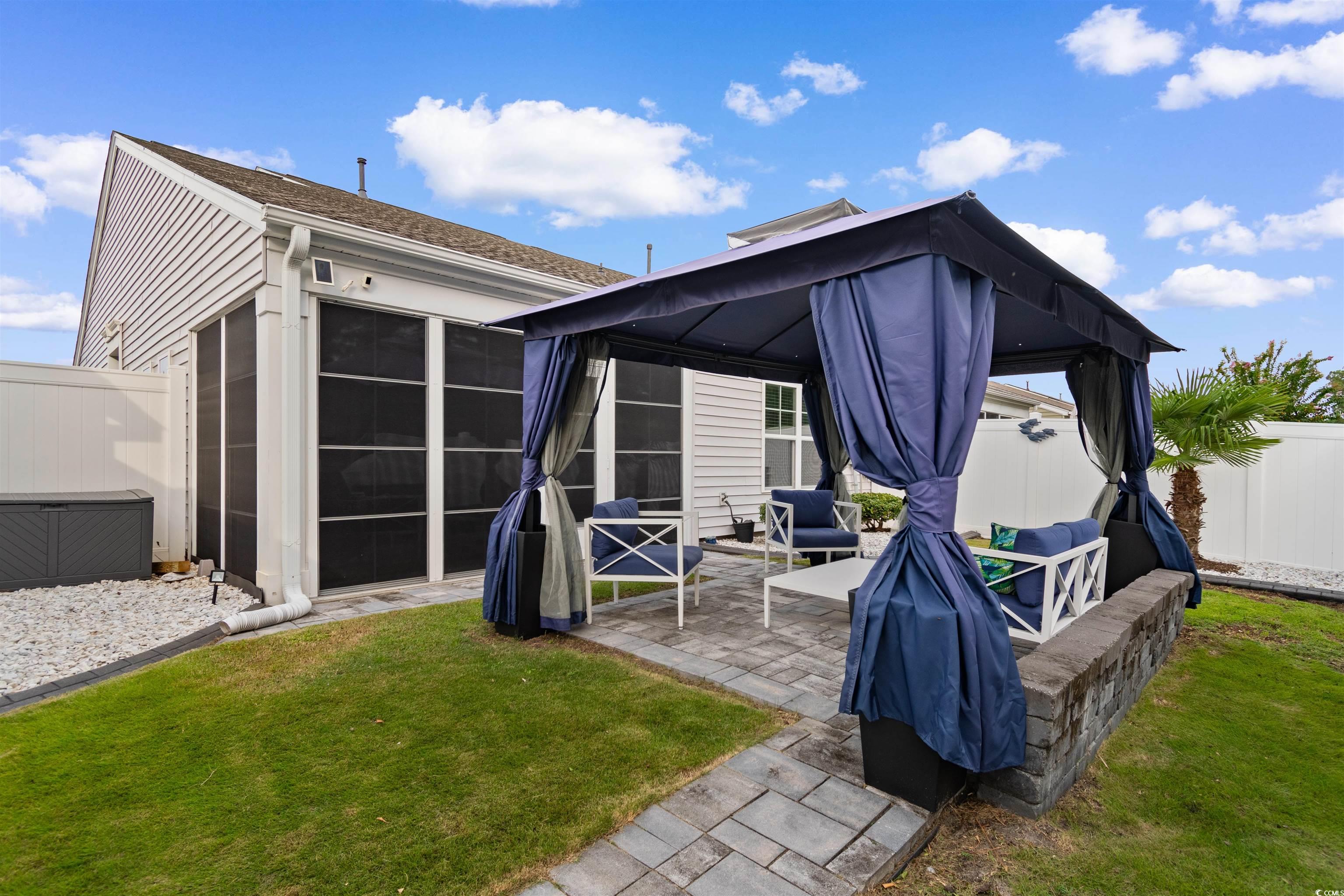 4380 Livorn Loop, Unit 4380 Myrtle Beach, SC 29579 - Photo 27 of 33 Fenced backyard with a gazebo, an outdoor living space, and a patio area