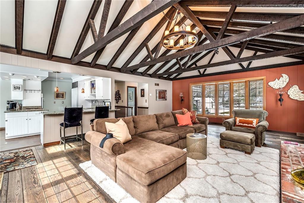 177 Canterbury Road Canonsburg, PA 15317 - Photo 10 of 25 Family room with exposed beam/truss ceiling, beautiful rustic wood floor and is open to the kitchen which is great for entertaining.