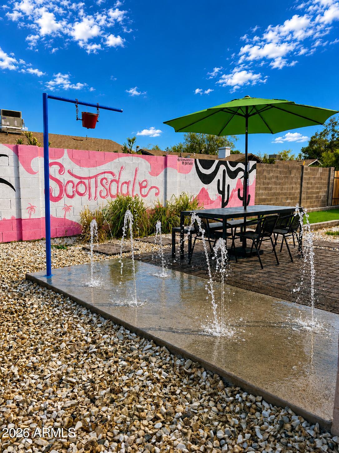 6943 East Granada Road Scottsdale, AZ 85257 - Photo 16 of 19 a view of a swimming pool with a patio
