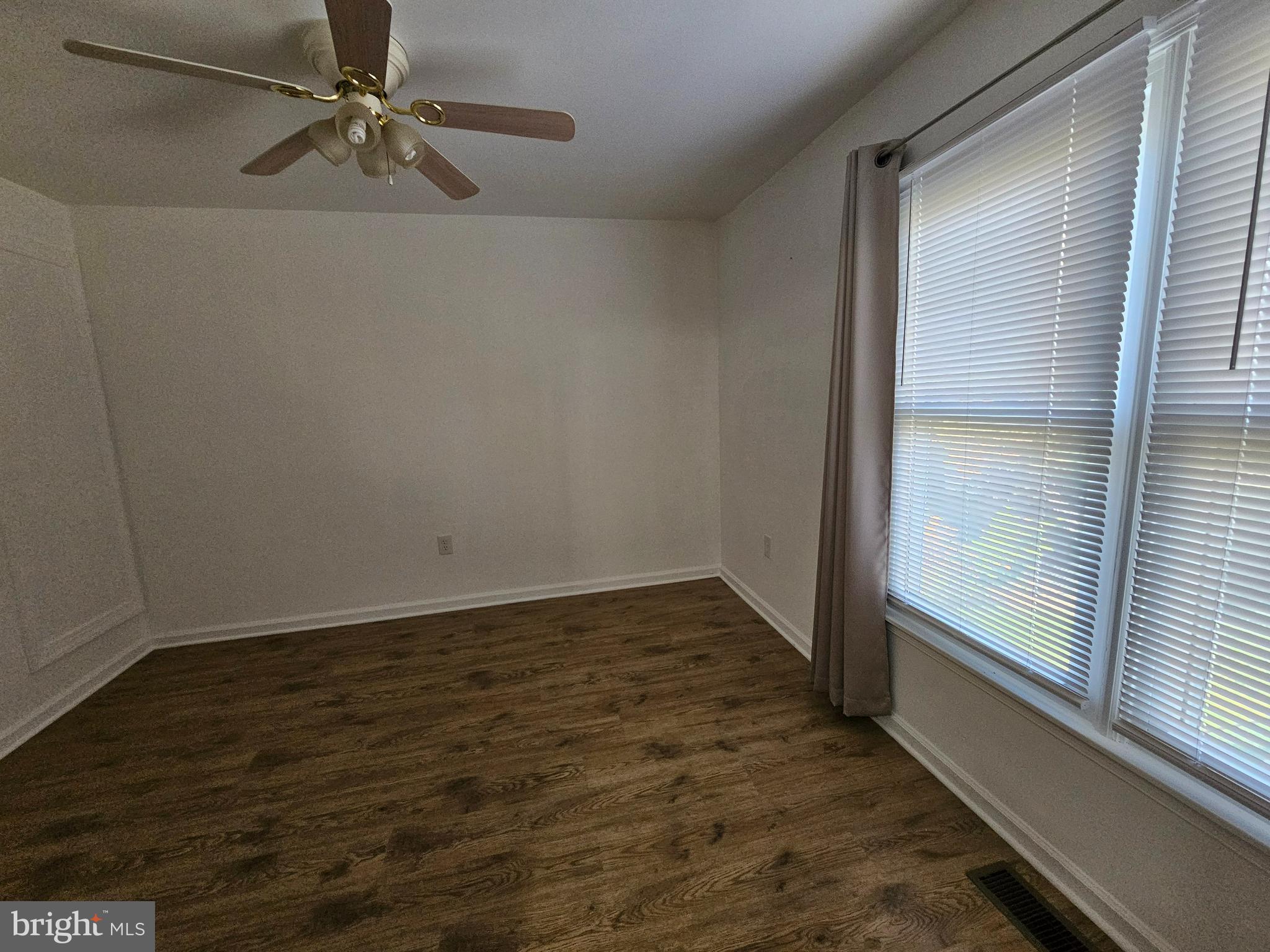 5 Thyme Street Elkton, MD 21921 - Photo 14 of 24 an empty room with wooden floor fan and windows