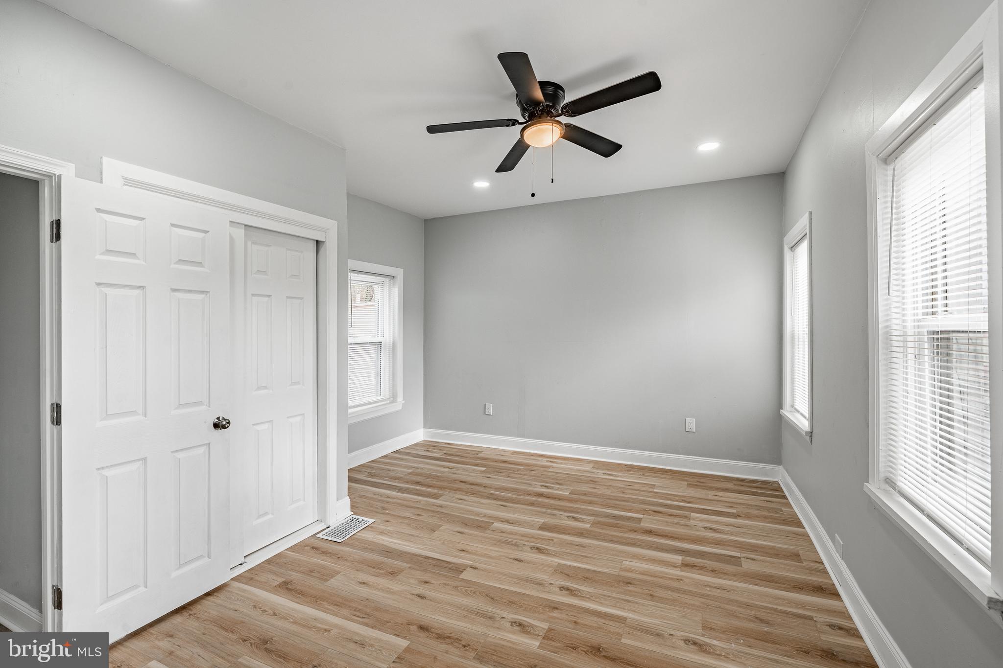 703 Walnut Street Pottstown, PA 19464 - Photo 13 of 24 wooden floor in an empty room with a window