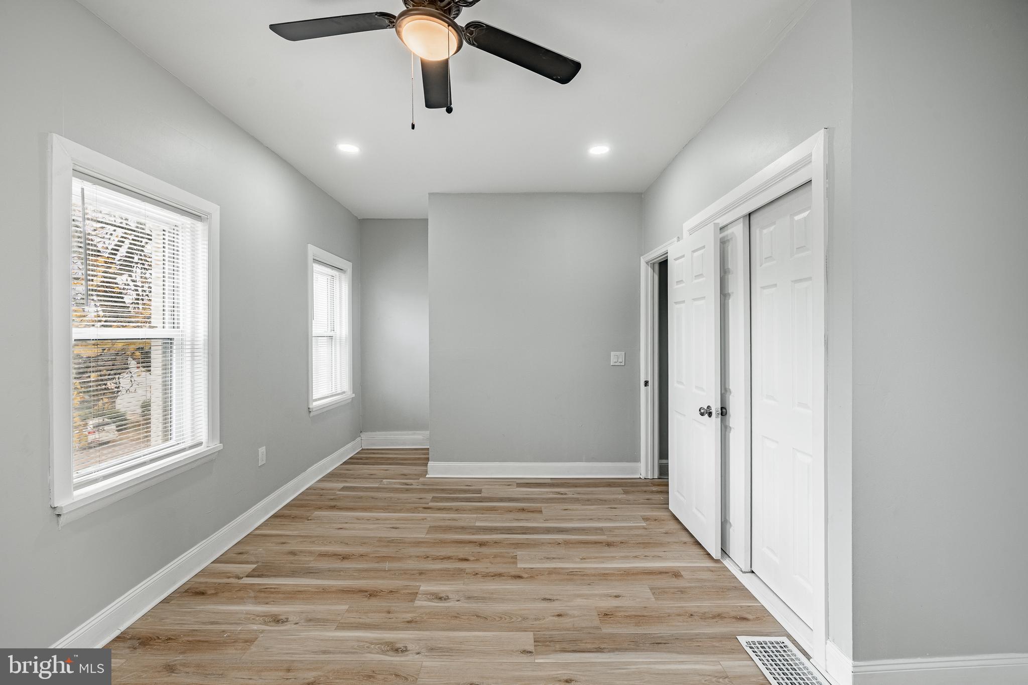 703 Walnut Street Pottstown, PA 19464 - Photo 14 of 24 a view of an empty room with wooden floor and a window