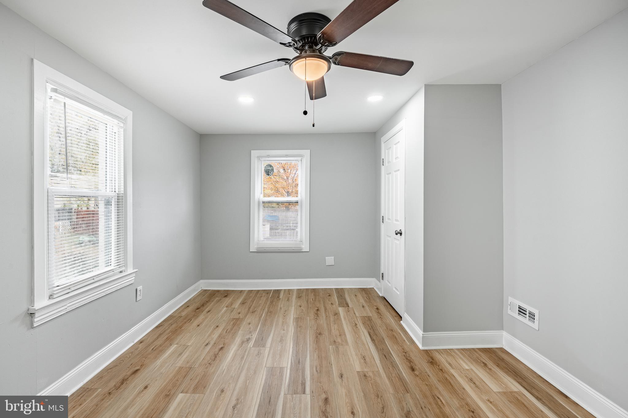 703 Walnut Street Pottstown, PA 19464 - Photo 18 of 24 a view of empty room with wooden floor and fan