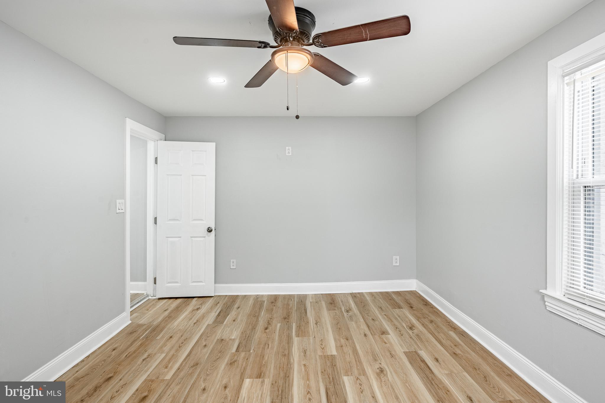 703 Walnut Street Pottstown, PA 19464 - Photo 19 of 24 wooden floor in an empty room with a window