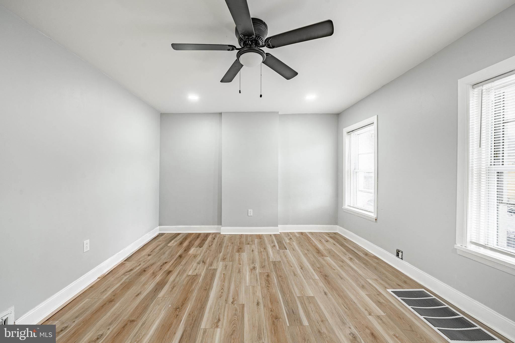 703 Walnut Street Pottstown, PA 19464 - Photo 21 of 24 wooden floor in an empty room with a window