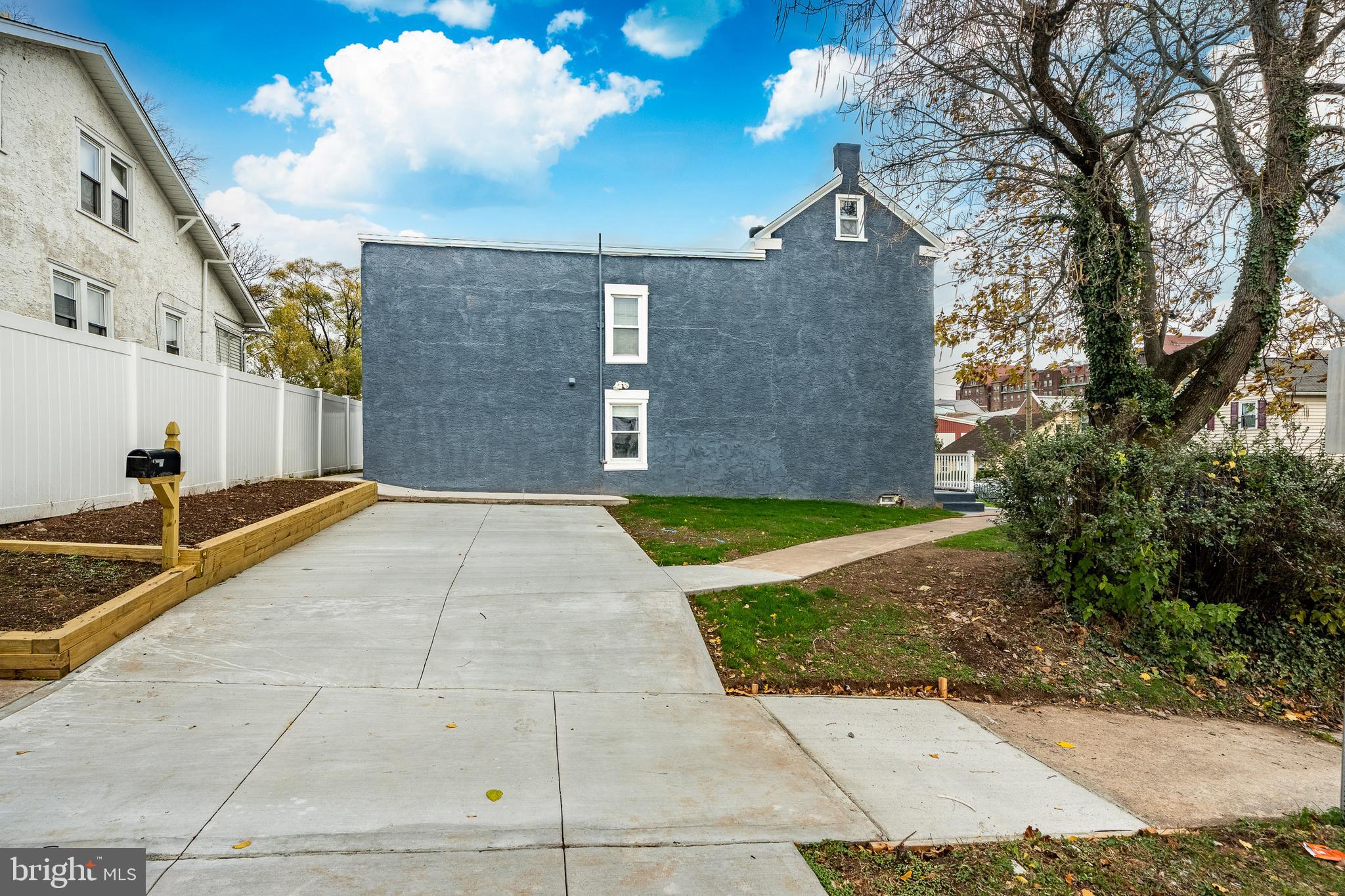703 Walnut Street Pottstown, PA 19464 - Photo 22 of 24 a view of yard with large trees