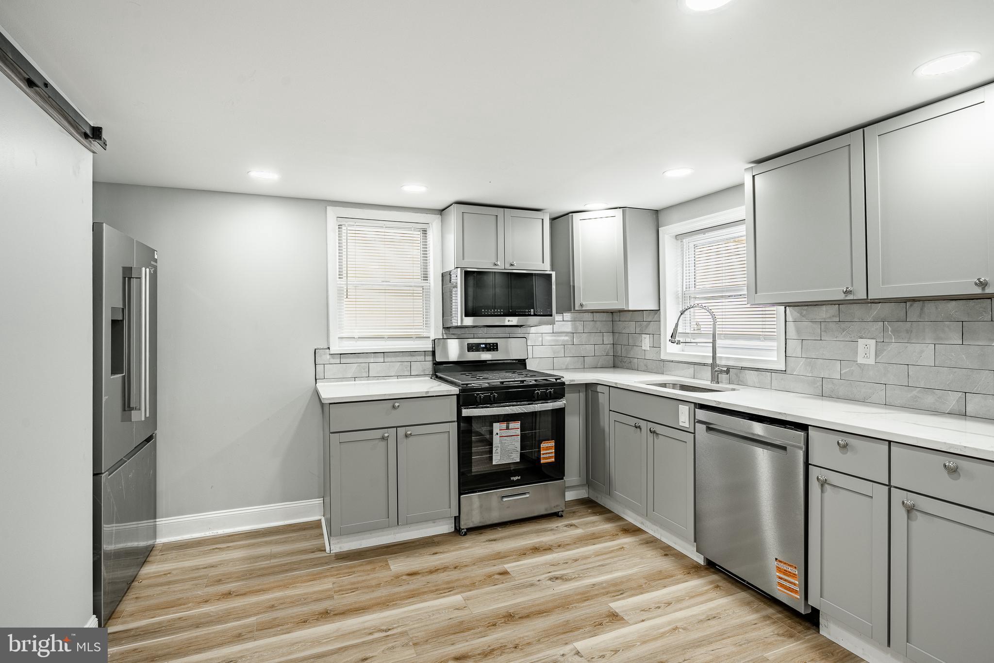 703 Walnut Street Pottstown, PA 19464 - Photo 8 of 24 a kitchen with cabinets stainless steel appliances and a counter space