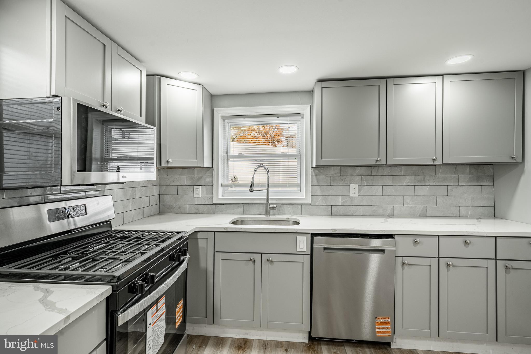 703 Walnut Street Pottstown, PA 19464 - Photo 9 of 24 a kitchen with cabinets and appliances