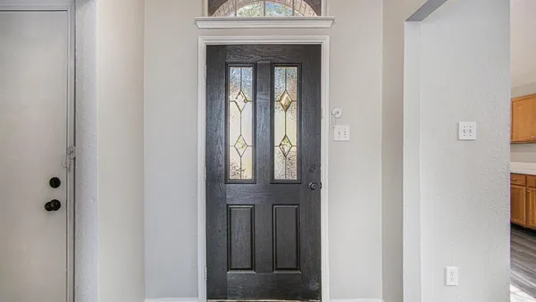 a view of front door with a sink