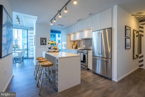 a kitchen with refrigerator a sink dishwasher and a refrigerator