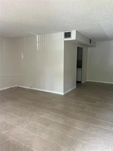 a view of a yard with tree s