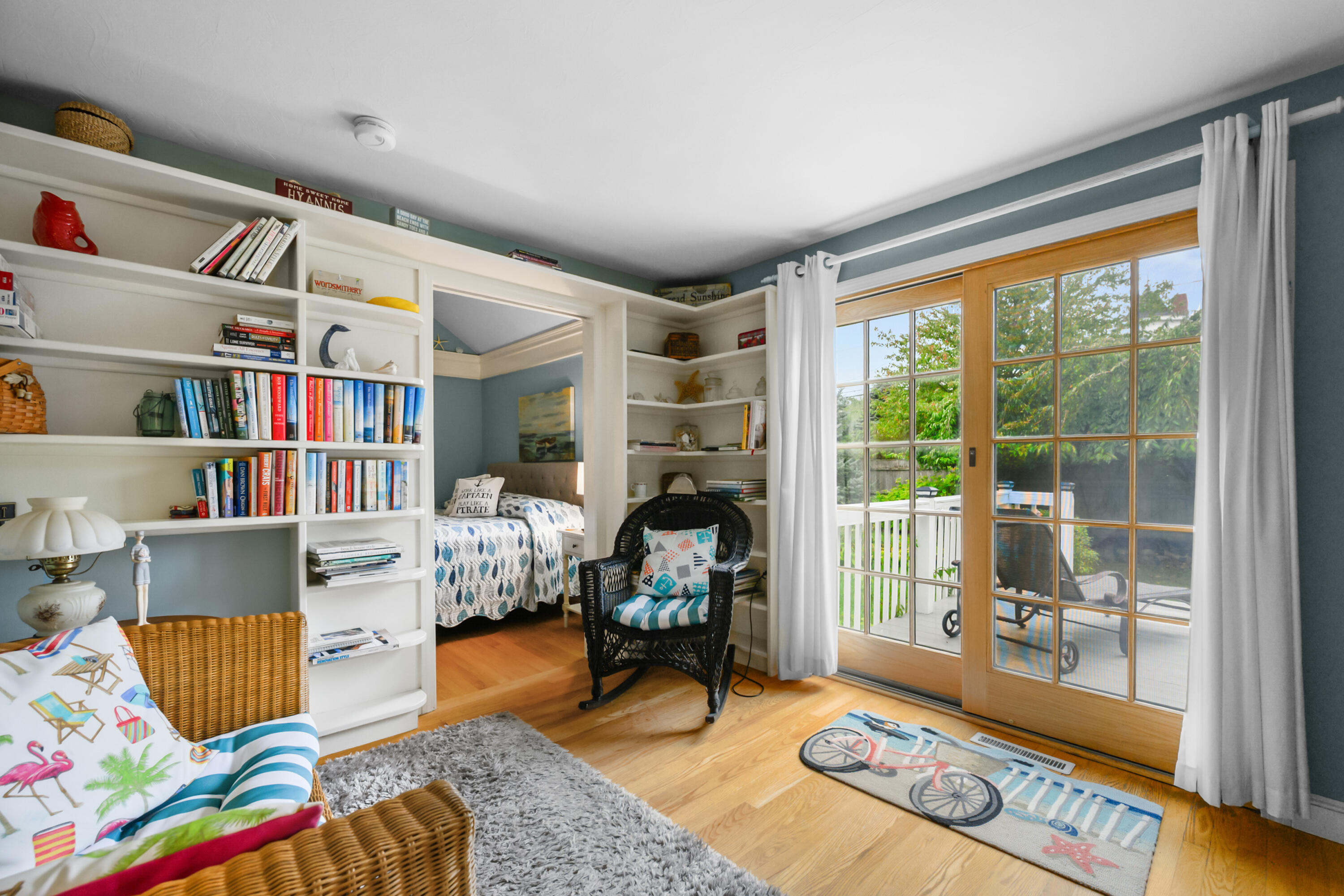 342 Sea Street Hyannis, MA 02601 - Photo 15 of 46 a living room with furniture and a book shelf