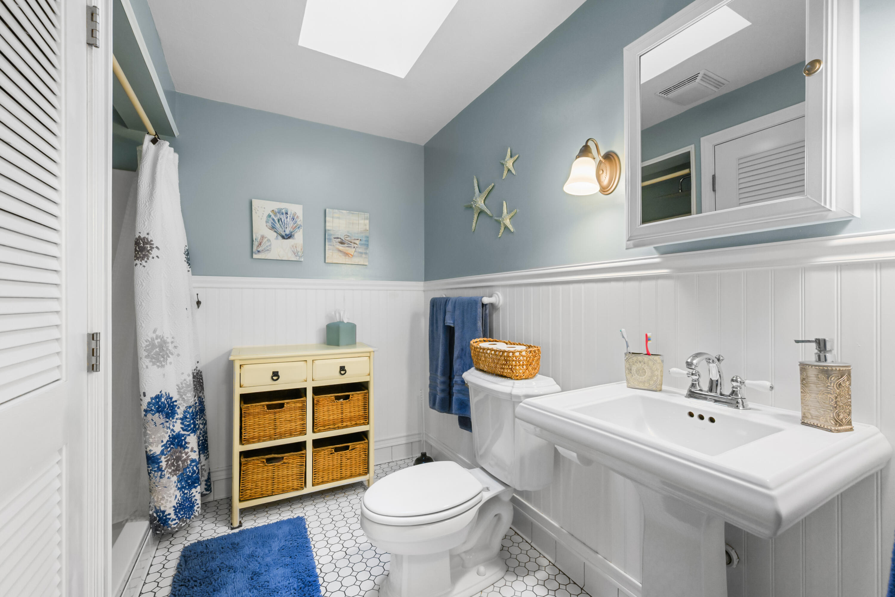 342 Sea Street Hyannis, MA 02601 - Photo 19 of 46 a bathroom with a sink toilet and a mirror