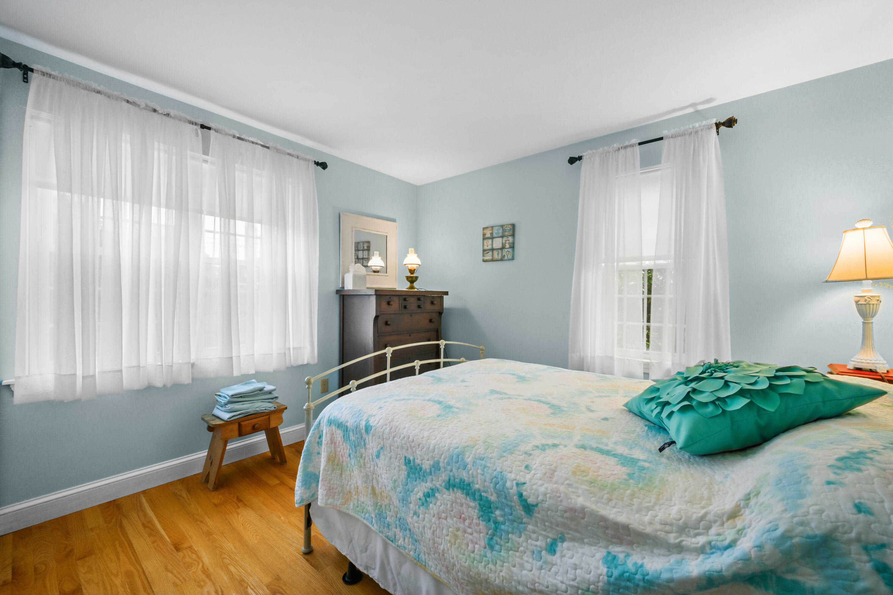 342 Sea Street Hyannis, MA 02601 - Photo 22 of 46 a bedroom with a bed and a table