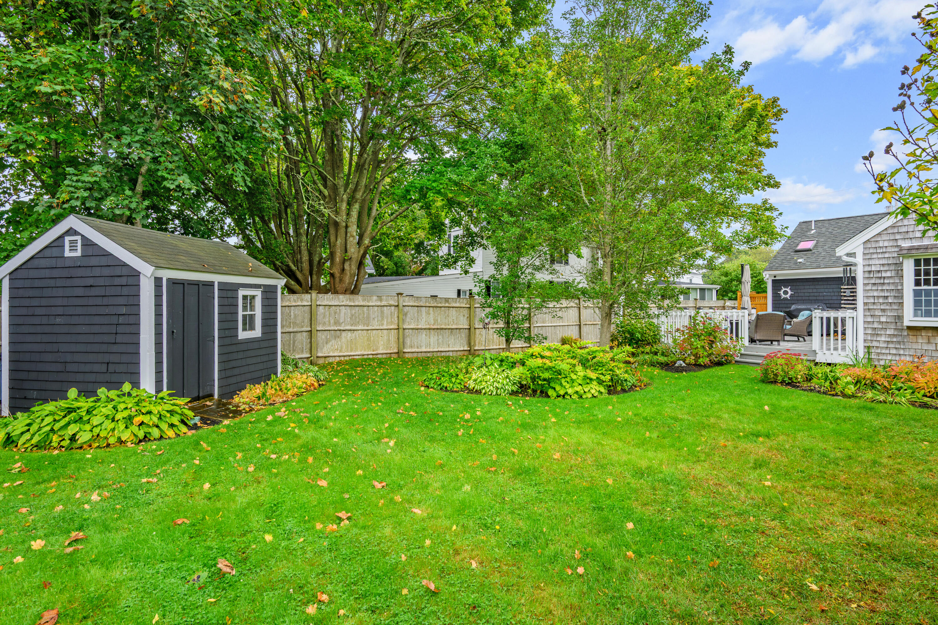 342 Sea Street Hyannis, MA 02601 - Photo 42 of 46 a view of a house with backyard and a tree