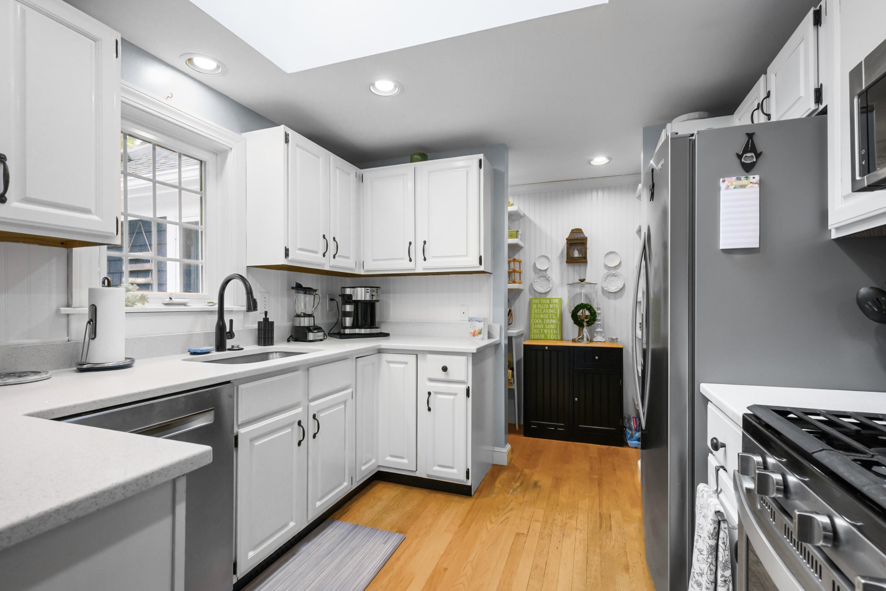 342 Sea Street Hyannis, MA 02601 - Photo 7 of 46 a kitchen with stainless steel appliances granite countertop a sink stove and refrigerator