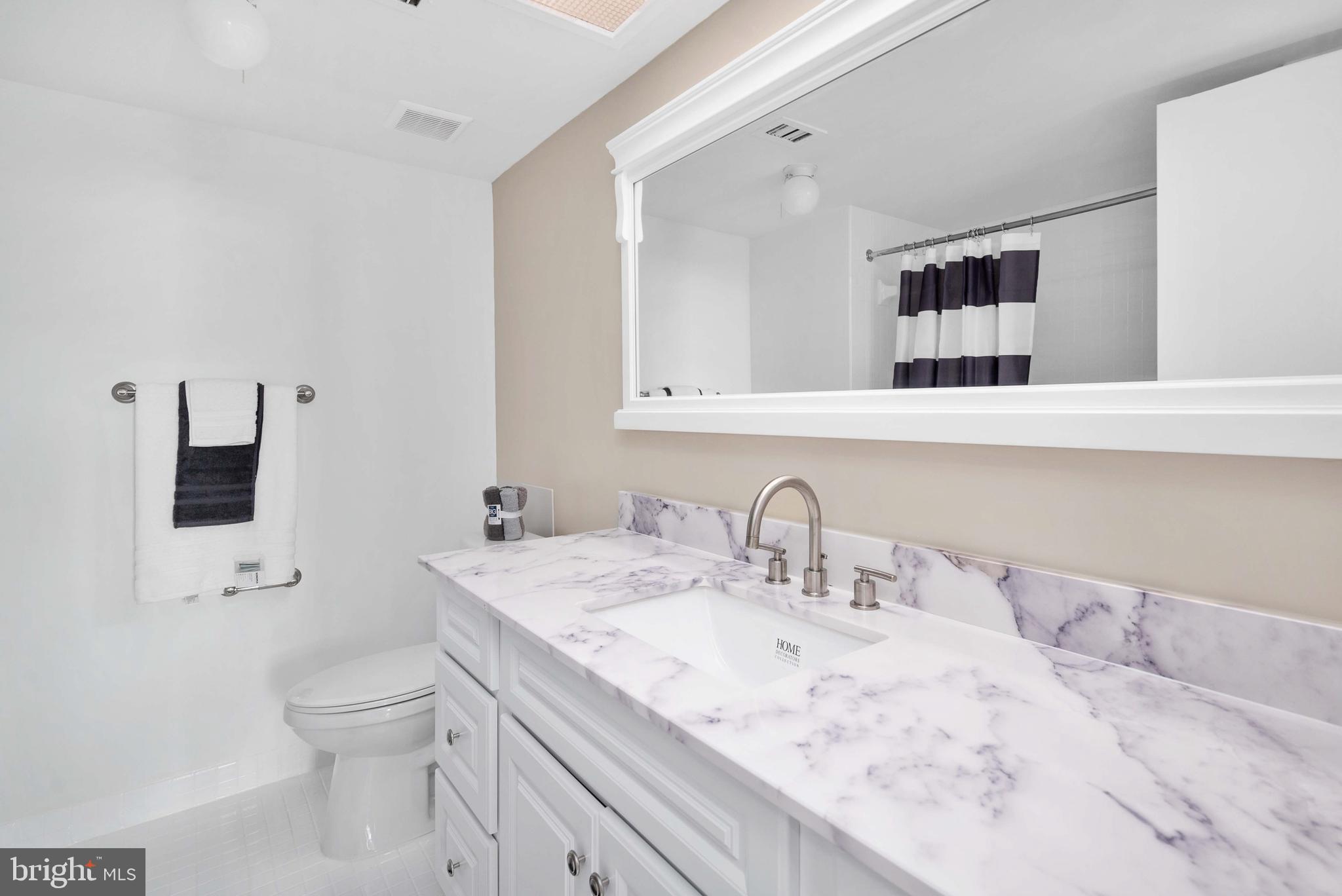 5501 Seminary Road, Unit 511S Falls Church, VA 22041 - Photo 29 of 44 a bathroom with a toilet sink and mirror