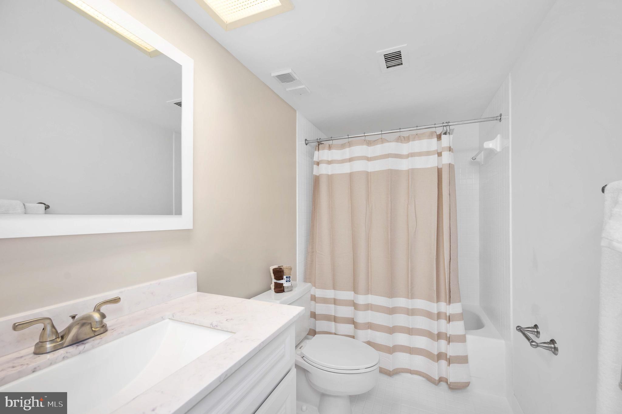 5501 Seminary Road, Unit 511S Falls Church, VA 22041 - Photo 33 of 44 a bathroom with a sink toilet and shower