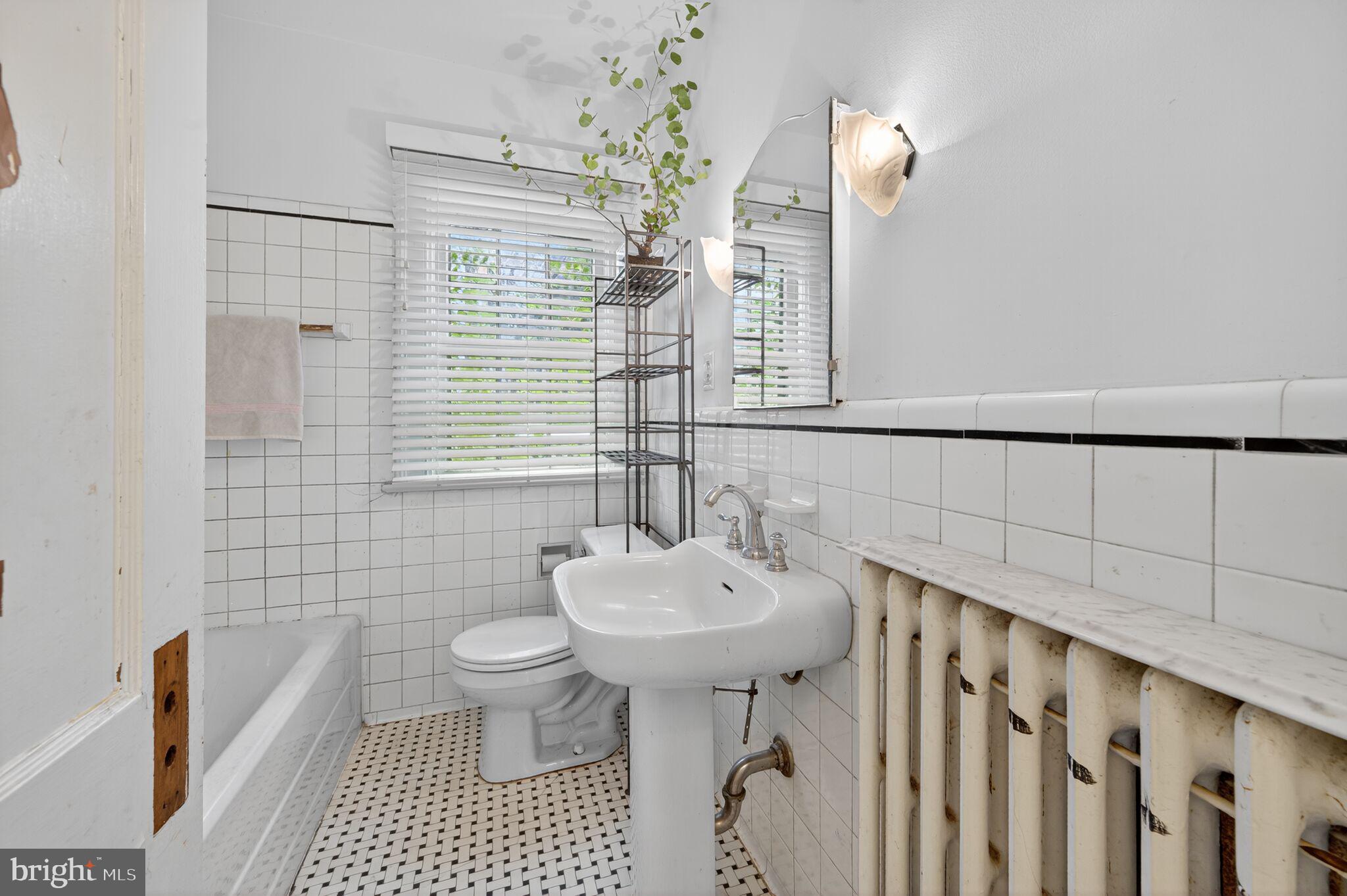 4919 Ashby Street Northwest Washington, DC 20007 - Photo 16 of 38 Full bath on main level