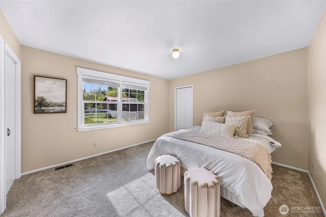 a bedroom with a bed and a closet