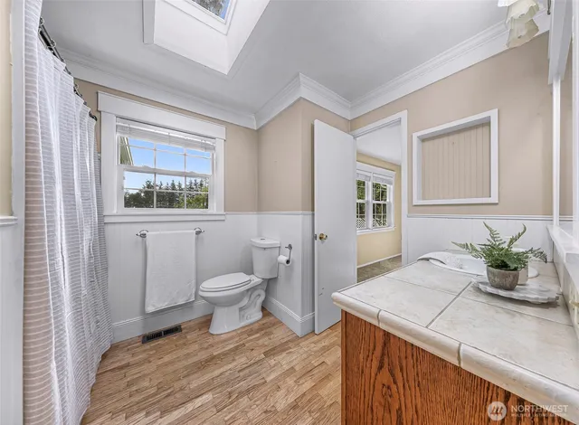 a bathroom with a sink vanity granite and a mirror