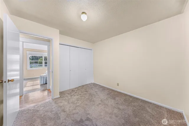 a view of a room that has a window in it