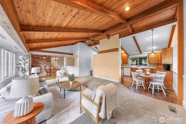 a view of a dining room with furniture window and outside view