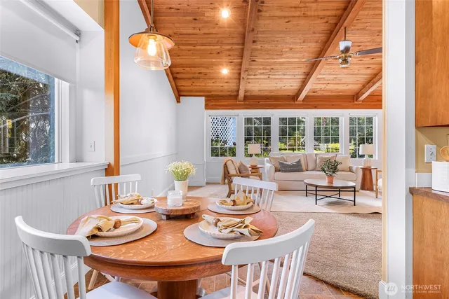 a large kitchen with a table and chairs