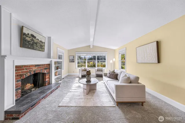 a living room with furniture and view of living room