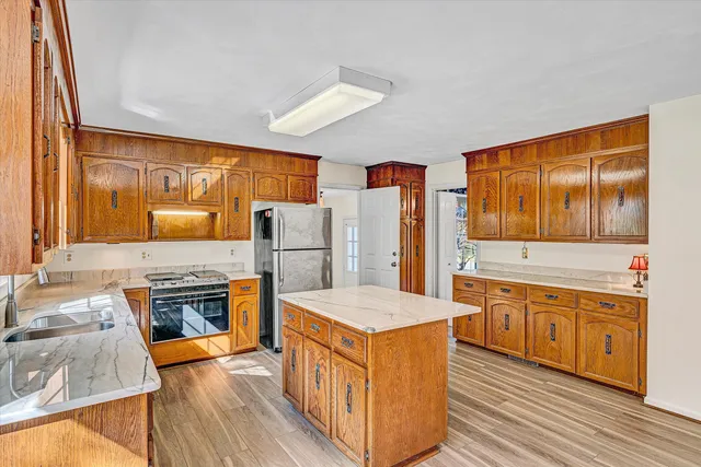 a view of a house with a yard and sitting area