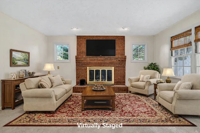 an aerial view of residential house with swimming pool and lawn chairs
