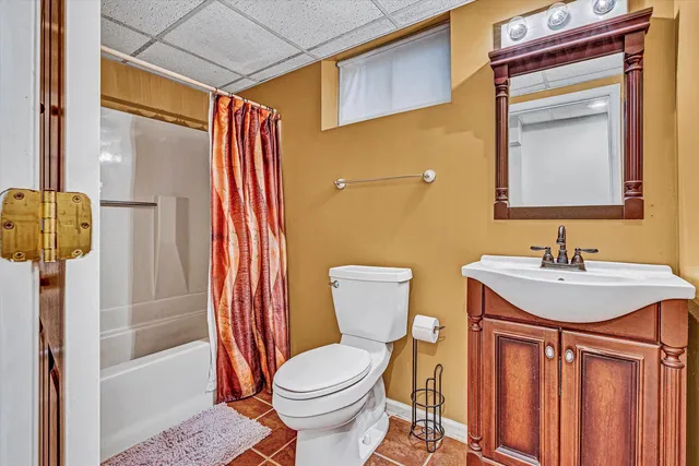 an aerial view of residential house with swimming pool and lawn chairs