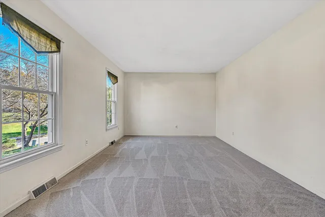 a view of kitchen and hall with a sink