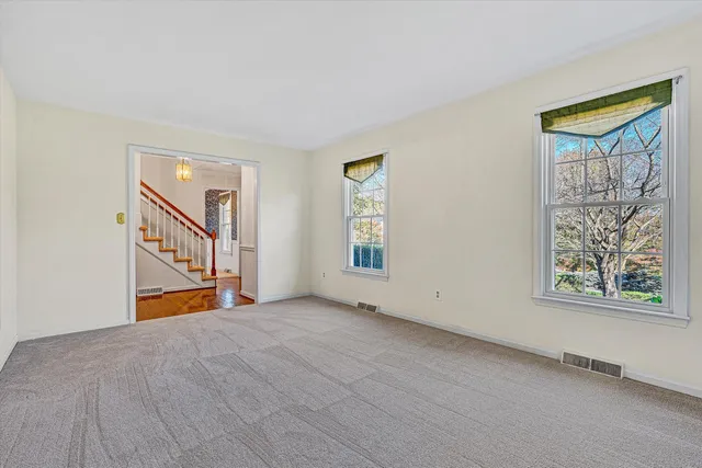 a large kitchen with stainless steel appliances granite countertop a large window and oven