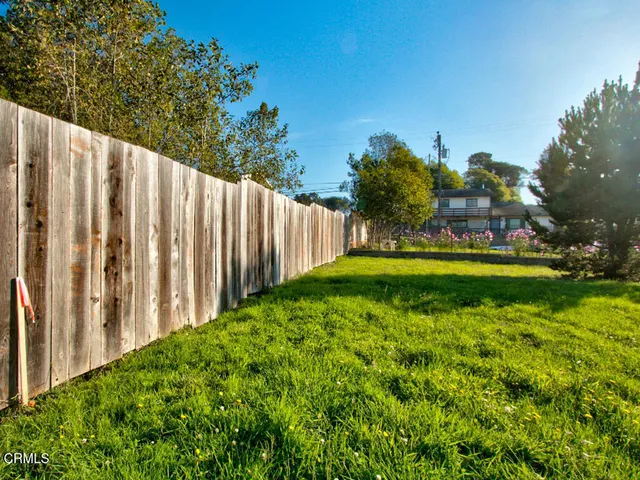 a view of a yard with swimming pool