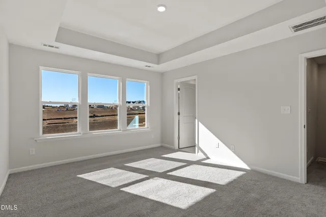 a view of a kitchen with a refrigerator wooden floor and a kitchen