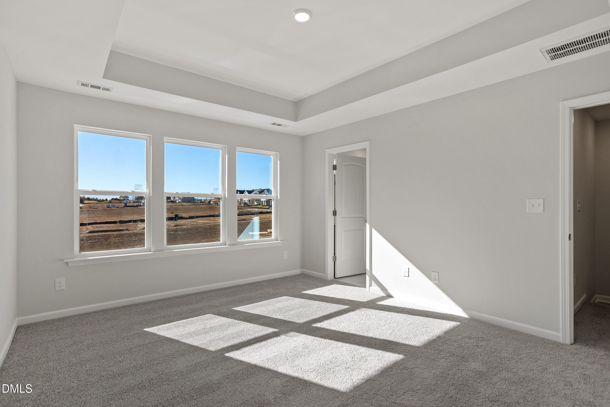 367 Chesapeake Commons Street, Unit 115 Garner, NC 27529 - Photo 13 of 43 a view of an empty room with a window