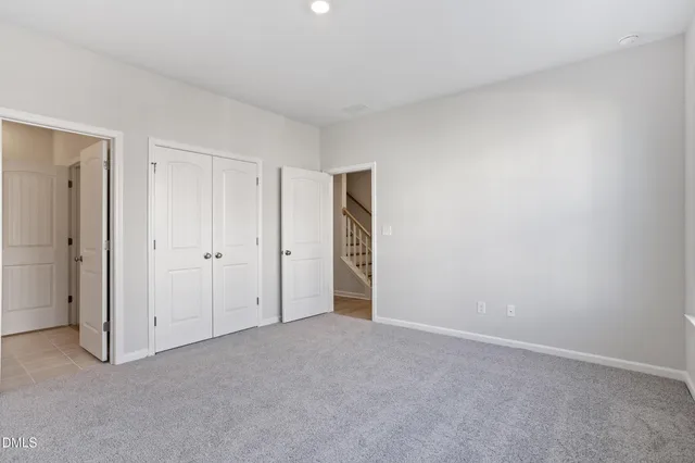 a bathroom with a sink toilet vanity and tub