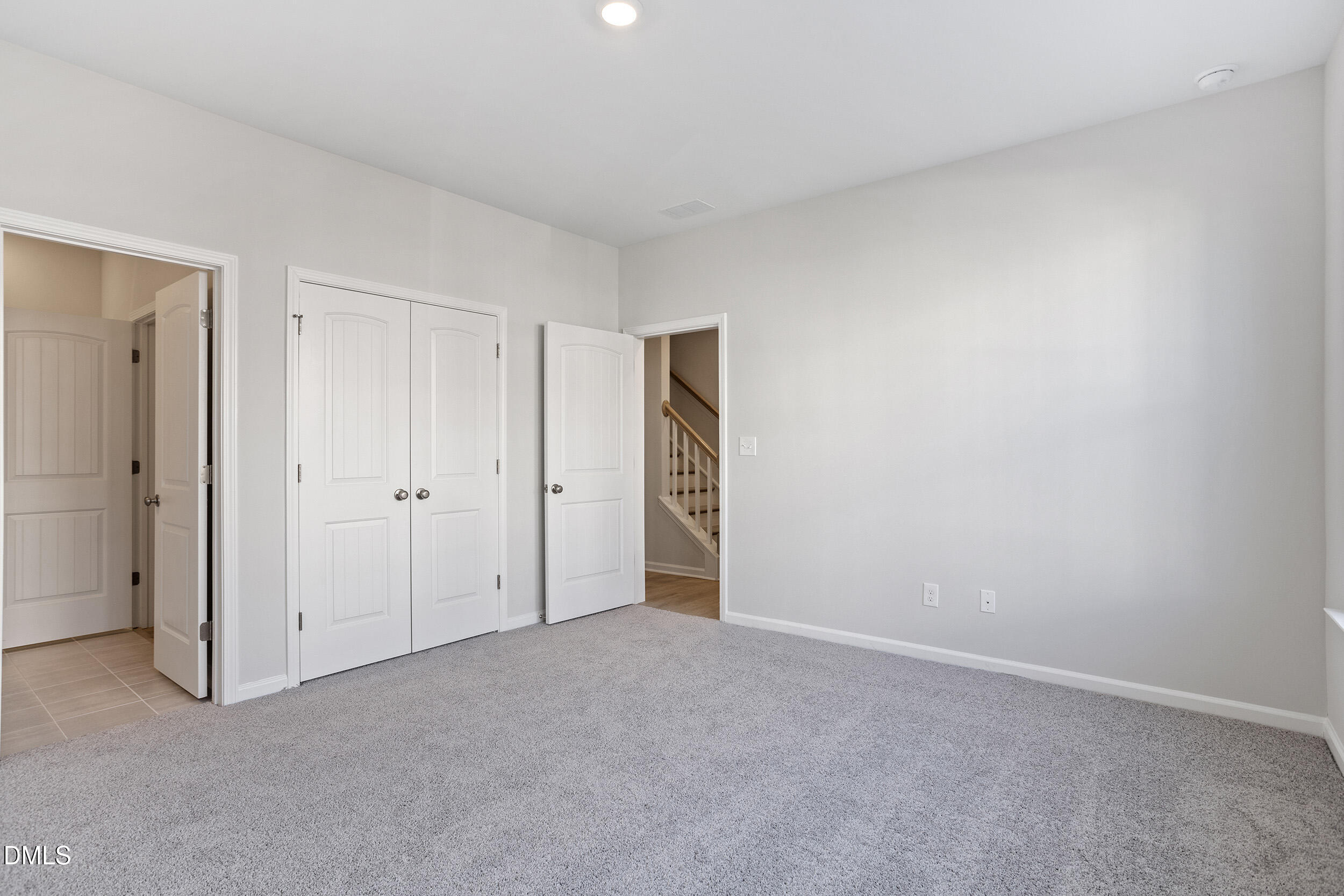 367 Chesapeake Commons Street, Unit 115 Garner, NC 27529 - Photo 22 of 43 a view of an empty room and closet area
