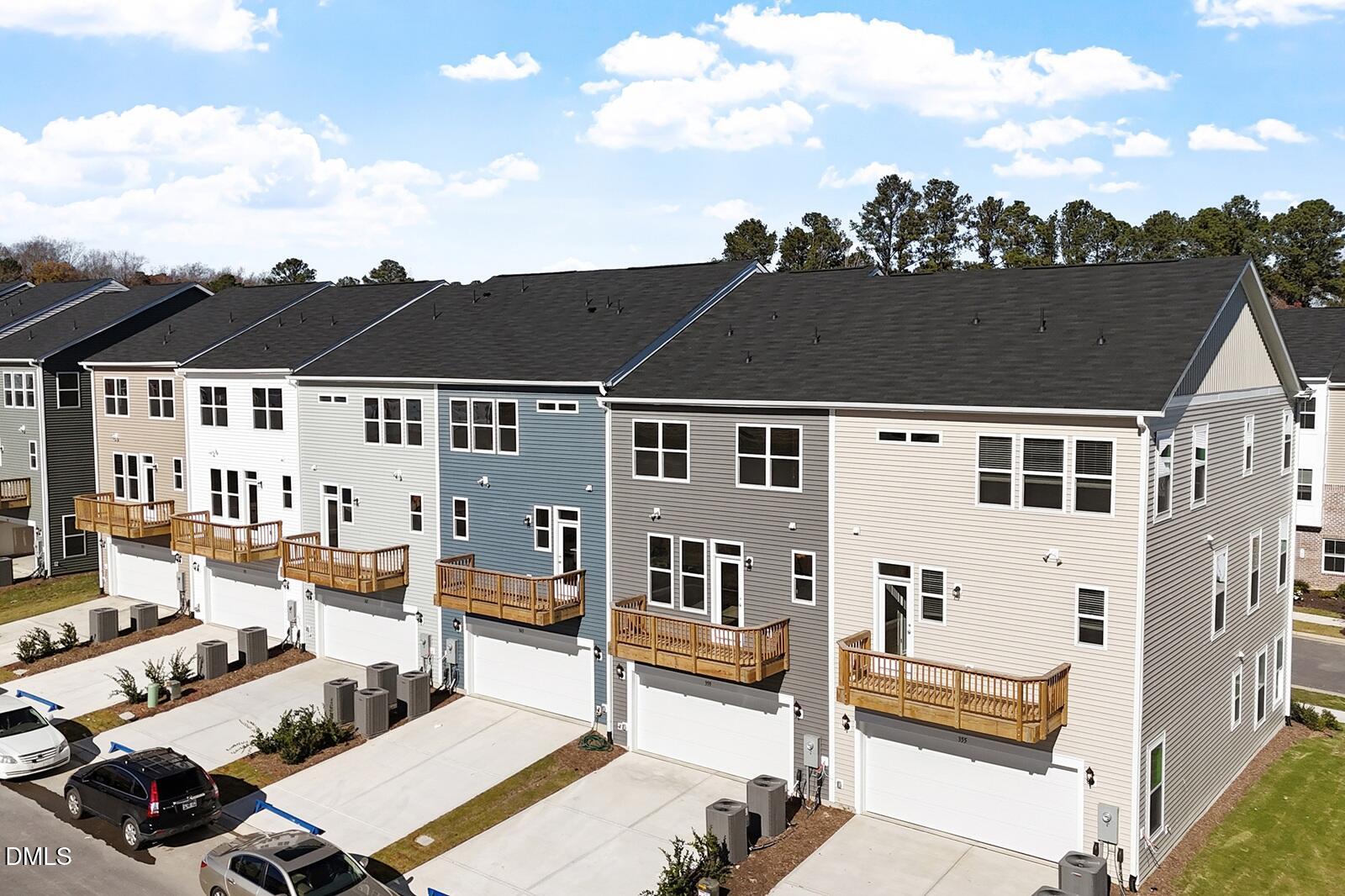 367 Chesapeake Commons Street, Unit 115 Garner, NC 27529 - Photo 25 of 43 an aerial view of a house with a balcony view