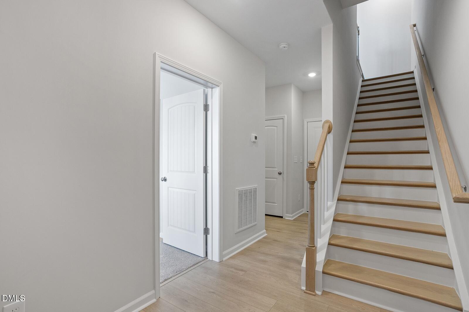 367 Chesapeake Commons Street, Unit 115 Garner, NC 27529 - Photo 2 of 43 a view of an entryway with staircase