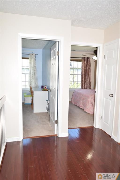 338 Lunar Road Piscataway, NJ 08854 - Photo 17 of 20 a view of a livingroom with furniture and wooden floor