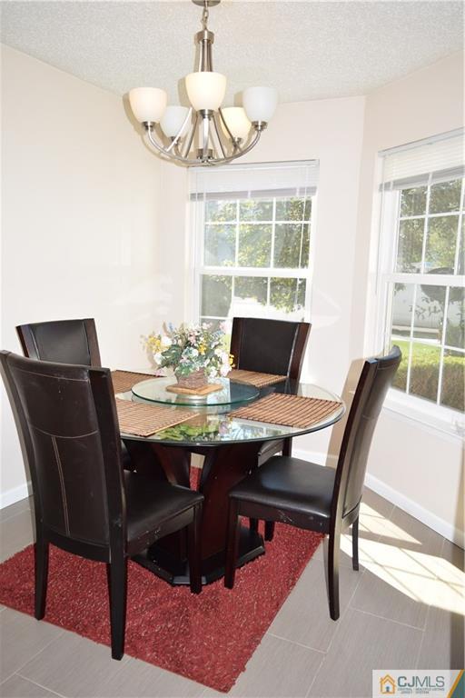 338 Lunar Road Piscataway, NJ 08854 - Photo 5 of 20 a view of a dining room with furniture window and outside view
