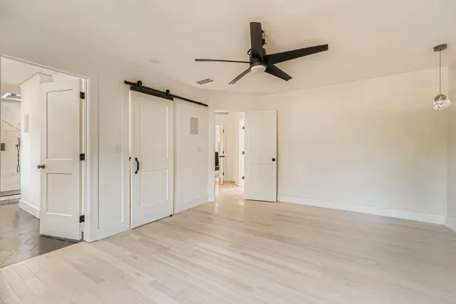 a bathroom with a double vanity sink mirror and bathtub