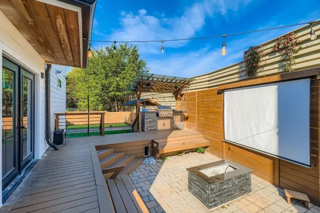 a view of backyard with seating space