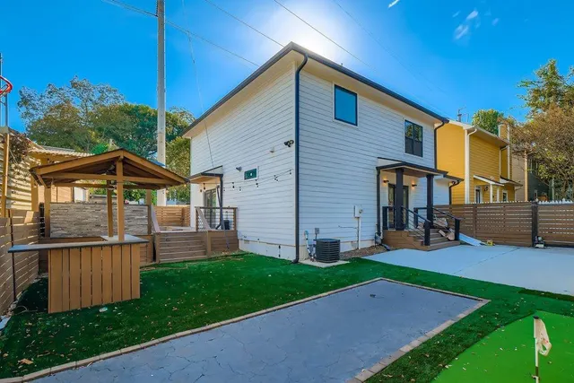 a view of house with backyard