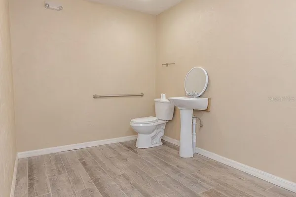 a front view of a house with a garden and plants