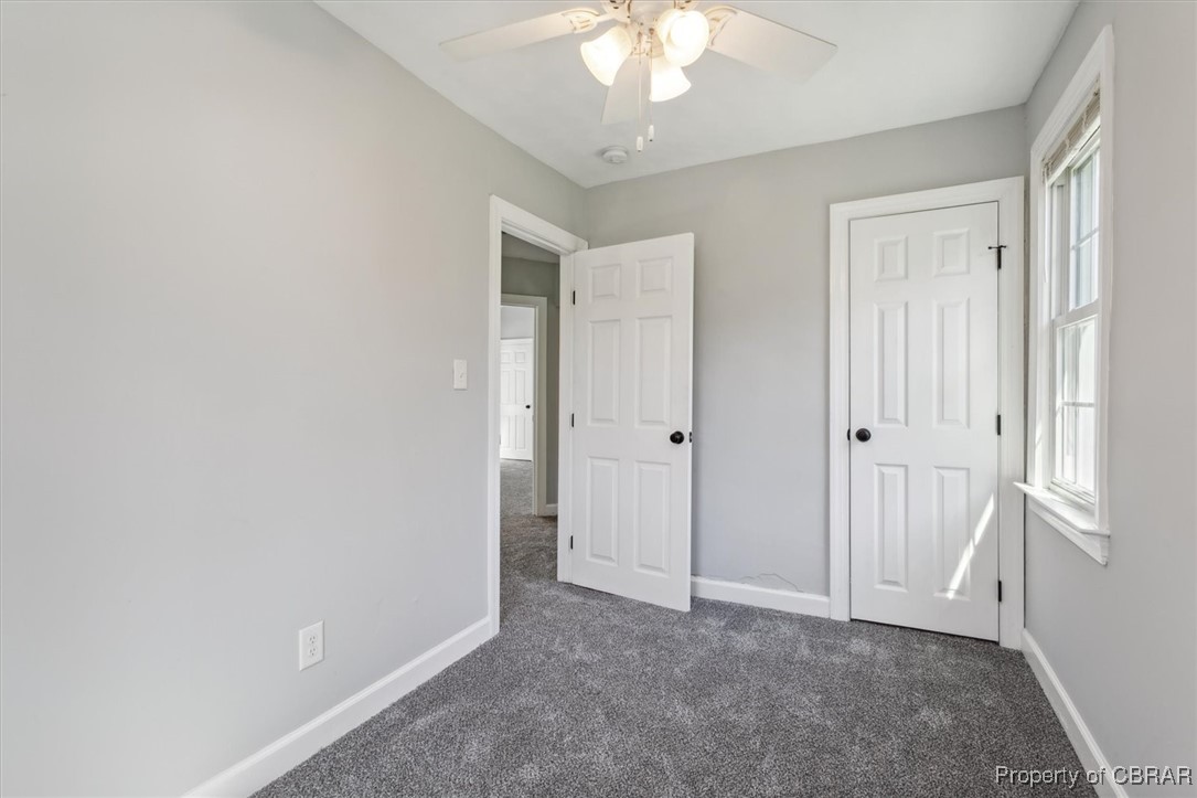 3810 Kecoughtan Road Hampton, VA 23669 - Photo 29 of 40 Unfurnished bedroom featuring dark colored carpet and ceiling fan