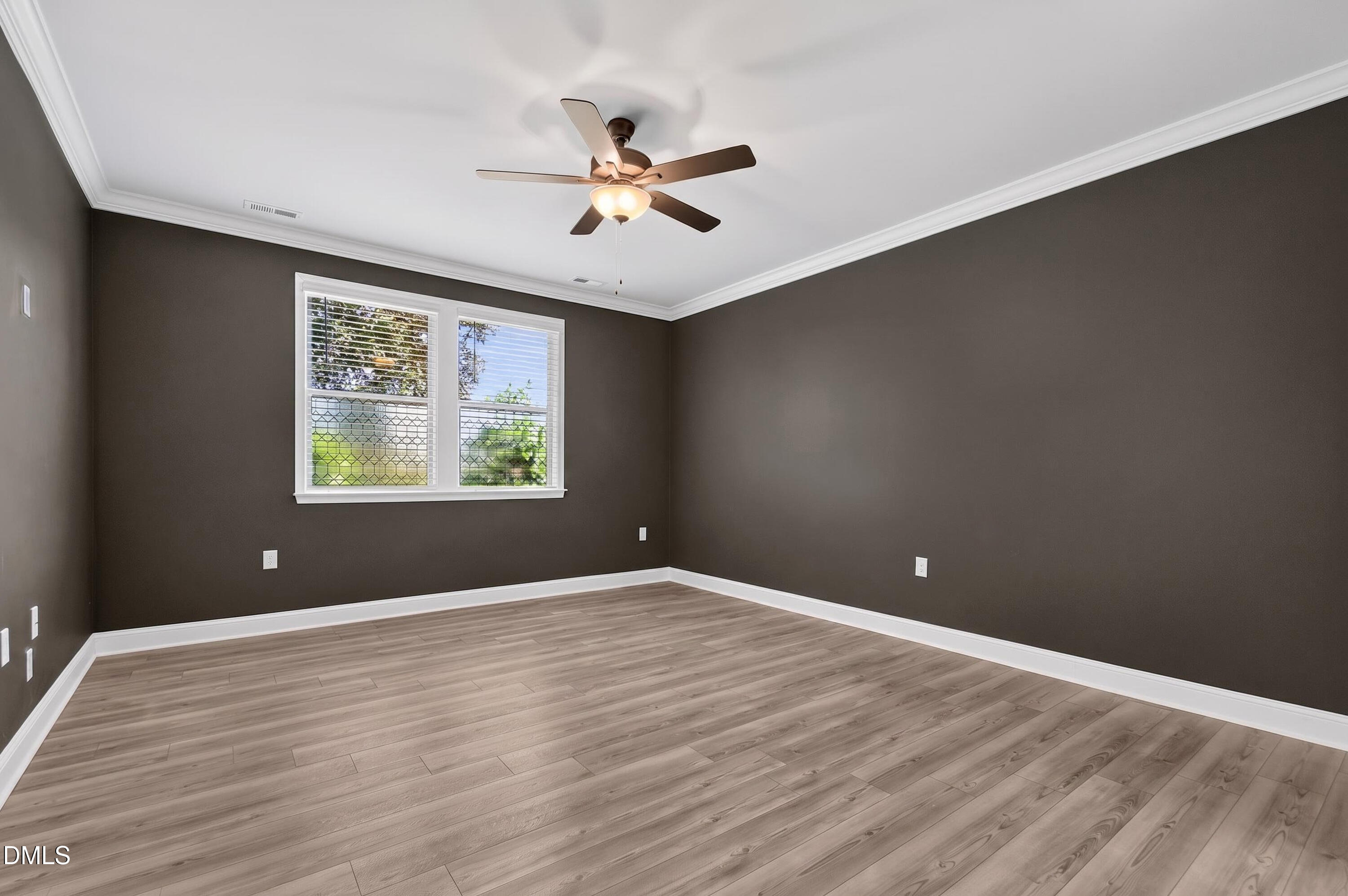 1300 Commons Ford Place Apex, NC 27539 - Photo 27 of 70 wooden floor in an empty room with a window