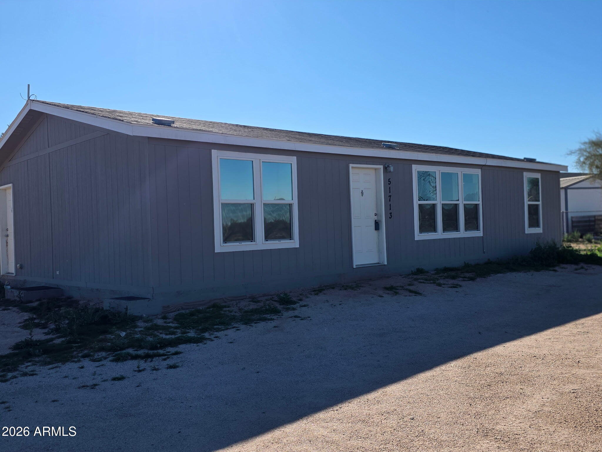 51713 West Fresno Road Maricopa, AZ 85139 - Photo 2 of 9 a backyard view of a house